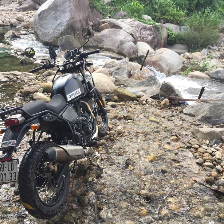 Vietnam motorbike ride near a mountain stream