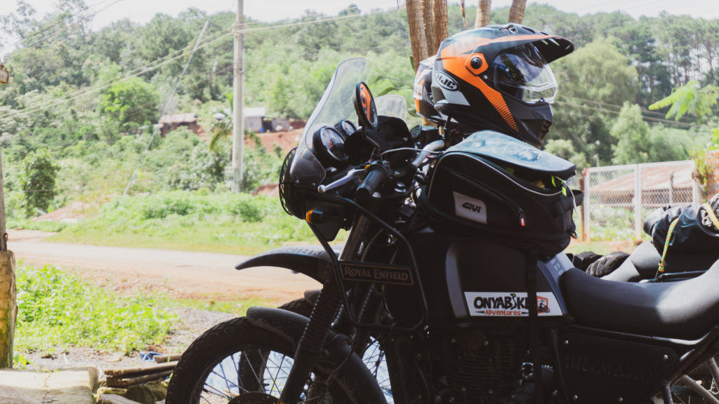 Royal Enfield Himalayan and a motorbike helmet in Vietnam