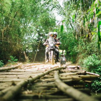 royal enfield motorbike tour on bridge in vietnam