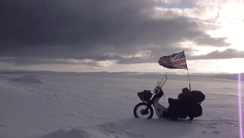 bike with a flag in the middle of nowhere