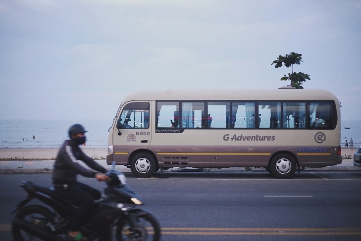 tour buses on a road in Vietnam