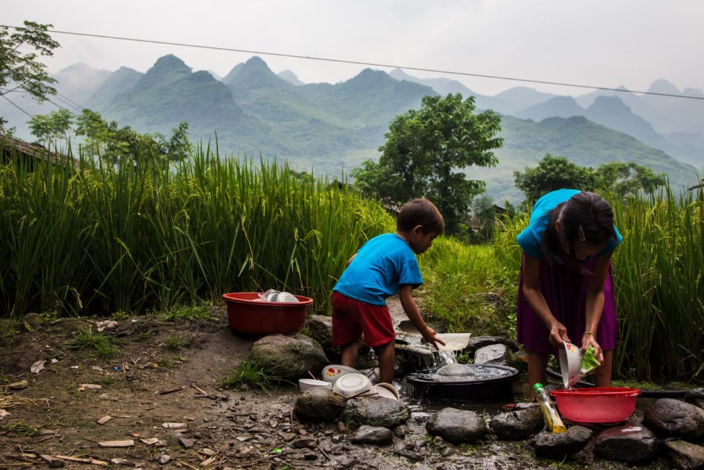 Washing dishes outdoors in Vietnam