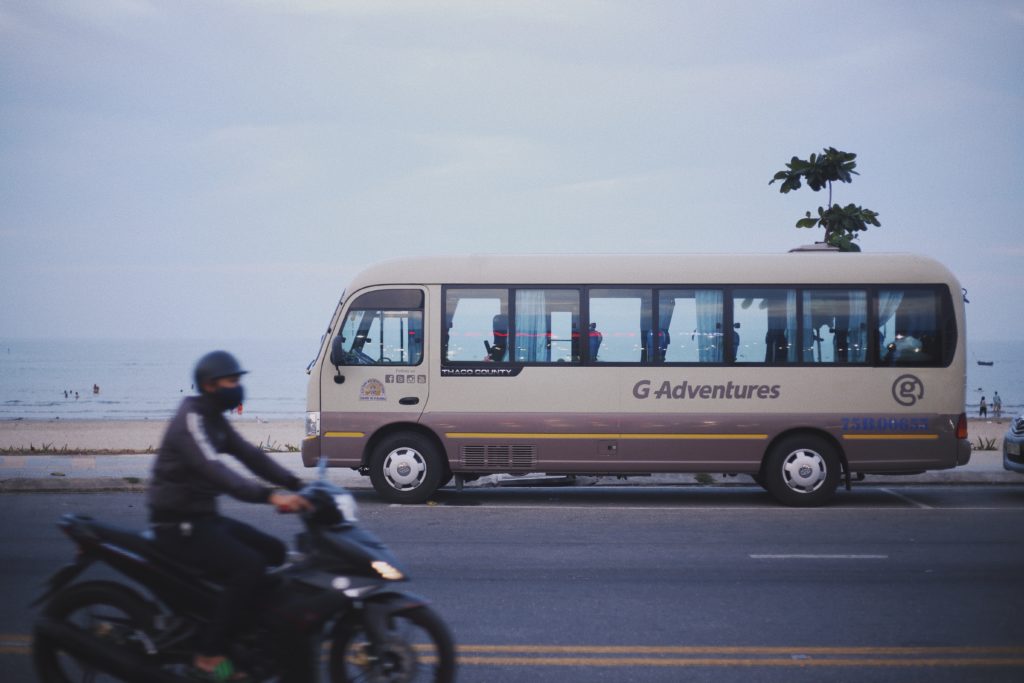 Tourists buses and and a motorbike at the Hai Van Pass