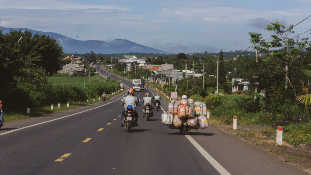 vietnam motorbike ride with goods stacked