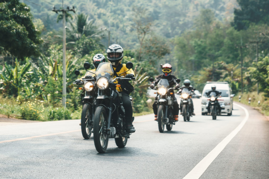 Onyabike Adventures wearing motorbike helmets in Vietnam