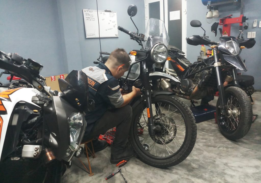regular motorbike maintenance with a mechanic in Vietnam